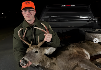Successful deer hunt with Thibodeau Outdoor Adventures; hunter posing with 8-point buck