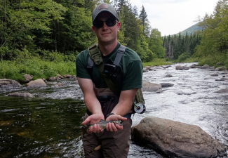 Fly fishing for trout in Maine autumn