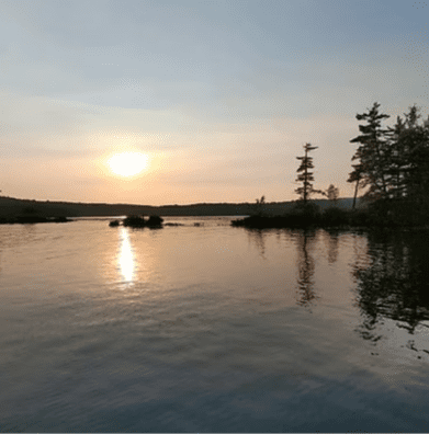 Sunset paddle on Belgrade Lakes, a relaxing Guided Maine Outdoor Adventure